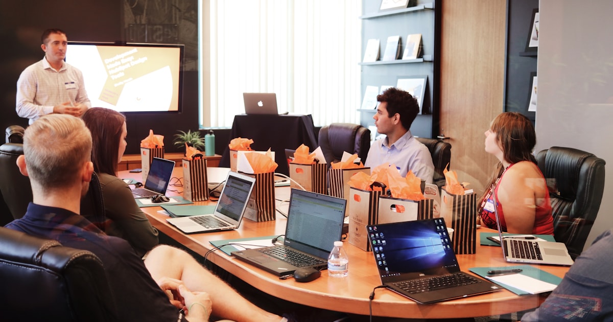 Laptop showing YouTube analytics dashboard on a desk