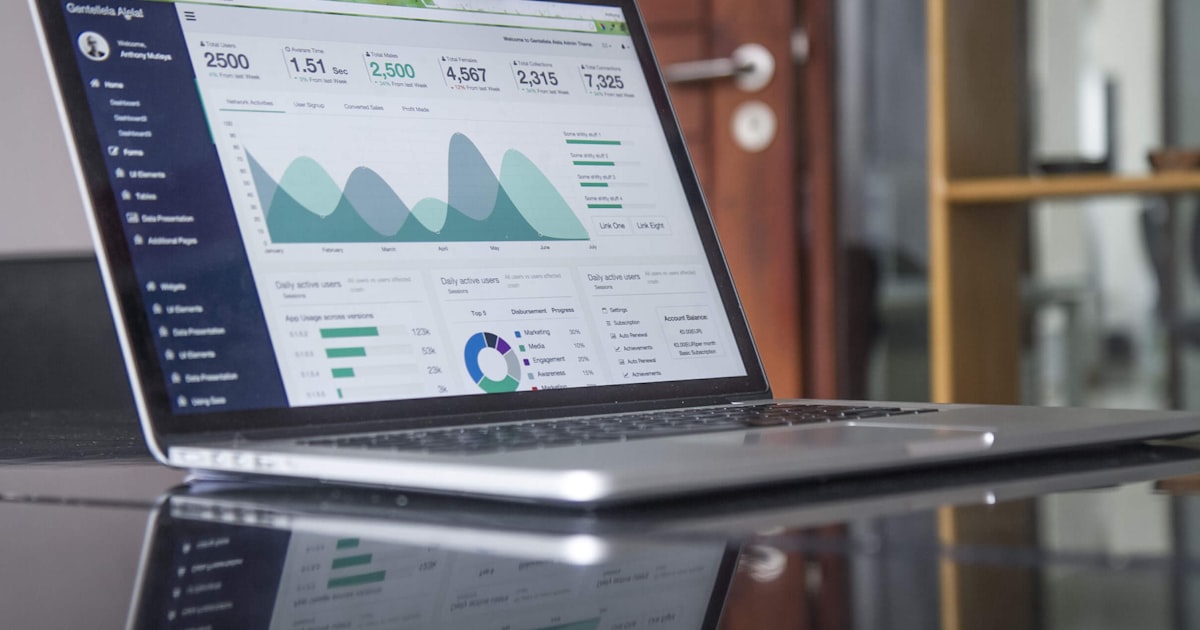 Laptop with SEO analytics and optimization charts